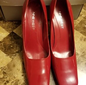 Red patent leather pumps